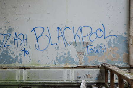 lancashire, England, 04/04/2014, Whittingham Mental Asylum, An old abandoned wall with spray paint and peeling paint , in an abandoned building. Exploring urban decay.のeditorial素材