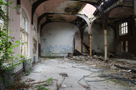 lancashire, England, 04/04/2014, Whittingham Mental Asylum, An old abandoned hall with spray paint and peeling paint , in an abandoned building. Exploring urban decay.のeditorial素材