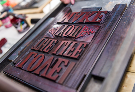 london, england, 05/05/2017 vintage wooden antique analogue typeset letter blocks being prepared for block printing.の写真素材