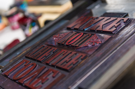 london, england, 05/05/2017 vintage wooden antique analogue typeset letter blocks being prepared for block printing.の写真素材