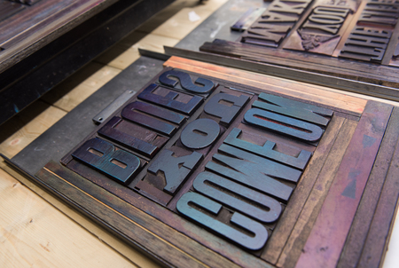 london, england, 05/05/2017 vintage wooden antique analogue typeset letter blocks being prepared for...