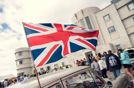Morecambe, England, 05/05/2017 A vintage retro british union jack flag blowing in the wind, outside the midland art deco hotel in morecambe england .のeditorial素材