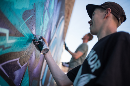 ulverston, England, 05/05/201, A graffiti artist working at a public exhibition of legal graffiti and street art. Art in the town of ulverston. A live graffiti wall been spray painted.のeditorial素材