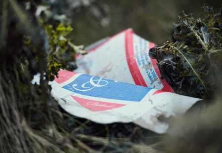 london, engalnd, 05/05/2017, Street litter fly tipping on the streets. Food waste and non recyclable food and product waste packaging discarded in urban areas.のeditorial素材
