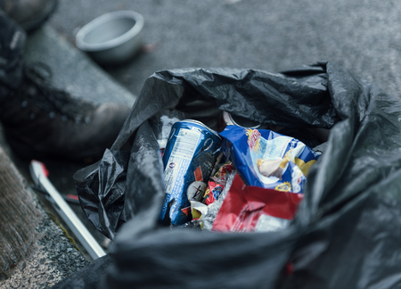 london, engalnd, 05/05/2017, Street litter fly tipping on the streets. Food waste and non recyclable food and product waste packaging discarded in urban areas.のeditorial素材