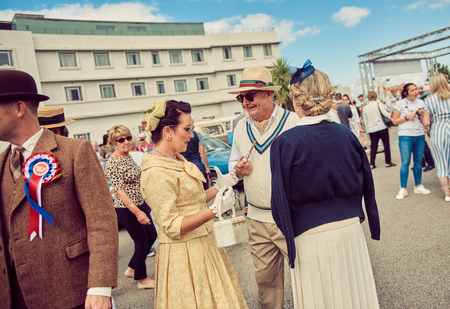 morecambe, England, 05/05/2017, A group of stylish retro vintage fashionable men and women acting and posing in fancy dress cosplay in a Best dressed award at a vintage event at the Midland hotel.のeditorial素材
