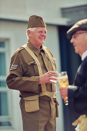 london, England, 05/05/2017, A stylish retro vintage world war two ww2 war veteran in soldier fancy dress uniform  Best dressed award at a vintage nostalgic 1940's event. のeditorial素材