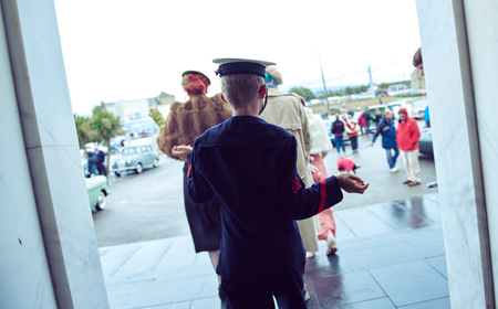 london, England, 05/05/2017, A stylish retro vintage fashionable young child in glasses wearing ww2 world war two american sailors uniform. Best dressed award at a vintage event.. のeditorial素材