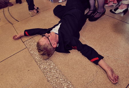 london, England, 05/05/2017, A stylish retro vintage fashionable young child in glasses wearing ww2 world war two american sailors uniform. Best dressed award at a vintage event.. のeditorial素材