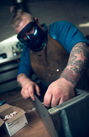 london, england, 02/02/2018, Young industrial metal working apprentice worker, learning various...