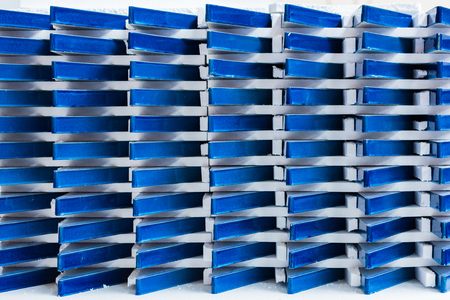 Beautiful glossy art deco tiles in a factory warehouse setting. Nostalgic timeless tile decoration, ready to be shipped out. art deco manufacturing.の写真素材