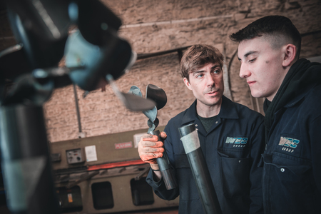 london, england, 02/02/2018, Young industrial metal working apprentice workers learning various metal working skills in an industrial factory setting. Apprentice schemes returning to england.のeditorial素材