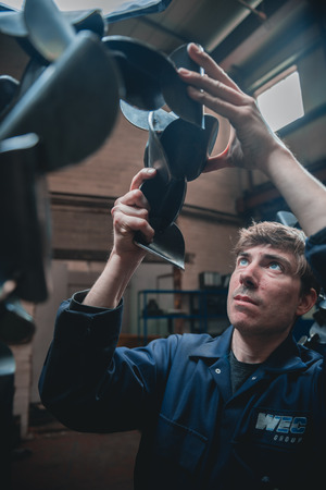 london, england, 02/02/2018, Young industrial metal working apprentice worker learning various metal...