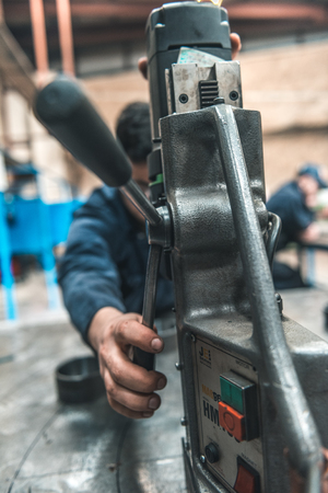 london, england, 02/02/2018, Young industrial metal working apprentice workers learning various...