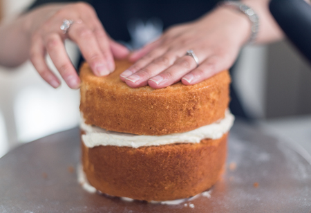A beautiful organic delicious orange warm baked sponge cake, with fresh cream inside.