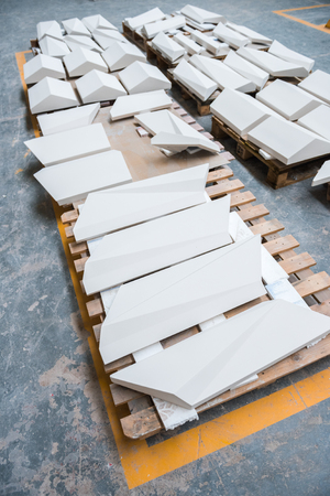 Beautiful matte tiles in a factory warehouse setting. Nostalgic timeless tile decoration, ready to be shipped out. tile industry manufacturing.の写真素材