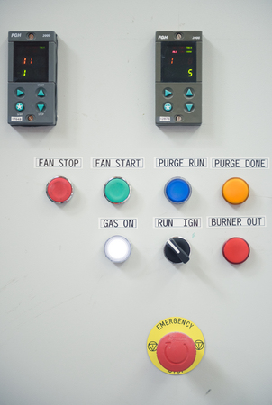 london, england, 05/05/2018  various factory machinery buttons on an electrical production line....