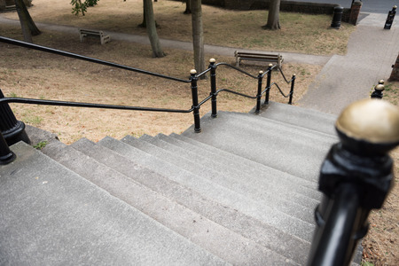 An empty French style paris style flight of stairs, with a steel metal handrail. beautiful victorian...