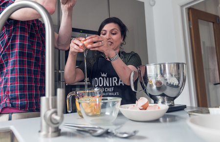 Lancashire, england, 05/05/2018  masterchef  2018 finalist moonira Hinglotwala, preparing food in a modern kitchen interior. home cooking, traditional indian cooking. television chef.のeditorial素材