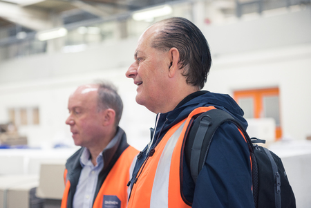 london, england, 05/05/2017 A group of workers in hi vis health and safety clothing vets, discussing...