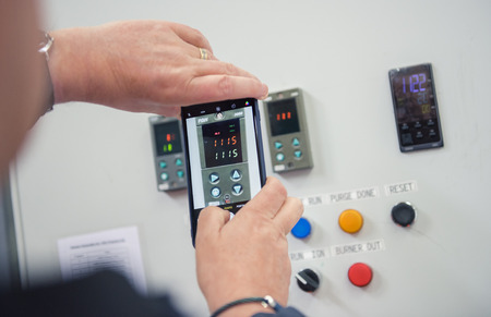 london, england, 05/05/2018  various factory machinery buttons on an electrical production line. operation operative buttons. emergency stop. run and ignite. Fans and burner.のeditorial素材