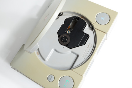 london, england, 07/05/2018 An original sony playstation console from 1994. PS1 retro video game console. old and discoloured vintage console. Sonys game hardware unit isolated on a white background.のeditorial素材