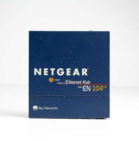 london, england, 05/05/2019 A retro outdated analogue netgear ethernet hub for computers and network...