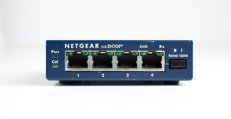 london, england, 05/05/2019 A retro outdated analogue netgear ethernet hub for computers and network...