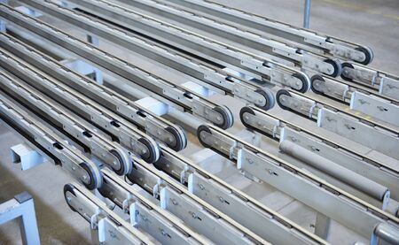 An empty industrial roller conveyor belt in a fully automated factory. roller conveyor to easily...