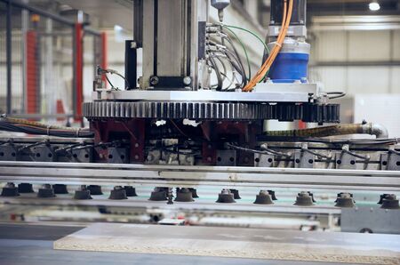 Industrial automated robot machinery in an industrial workshop factory environment. Automated...