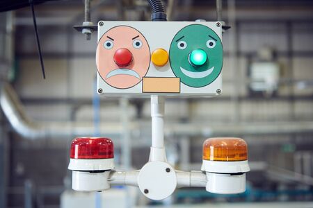 automated industrial factory control desk screens and buttons overseeing the automated machinery where humans are no longer needed. computers and robot controls making more money for corporations.の写真素材