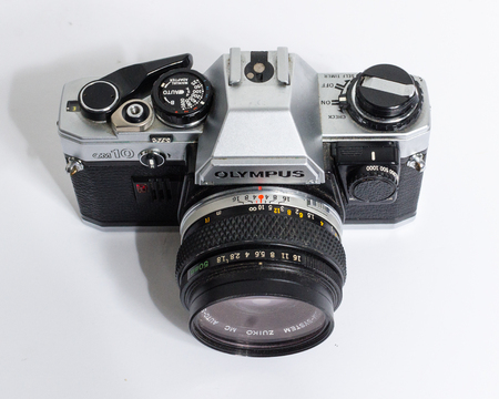 london, england, 05/05/2018 A Retro vintage olympus om 10 35mm single lens reflex film camera,and 50mm 1.8 lens. vintage hipster camera making a fashionable come back in youth culture.のeditorial素材