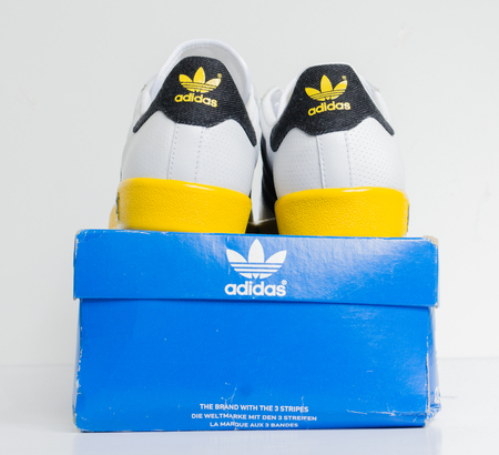 london, england, 05/05/2018  Adidas Forest Hills Vin White DK Grey/Sunshine vintage sneaker trainers. Blue suede adidas trainers, stylish retro football street fashion. famous three stripesのeditorial素材