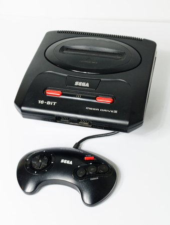 london, england, 05/05/2018 Sega megadrive 2 16 bit and Sega Mega drive 2 black shiny plastic retro...