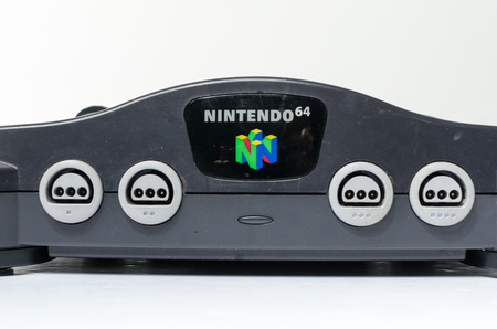 london, england 05/052019 Nintendo n64 Console on a white isolated background. iconic retro vintage video gaming machine. Japanese technology 64 bit gamers.のeditorial素材