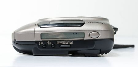 london, england, 05/05/2019  a retro vintage 1990s minolta 70w camera isolated on a white background. primitive digital photography camera. early digital cameras.のeditorial素材