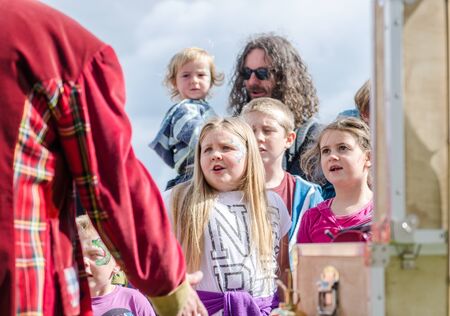 london, england, 05/05/2018 A group of happy smiling children in a crowd having fun. School children laughing and giggling and having the best times with entertainment.のeditorial素材