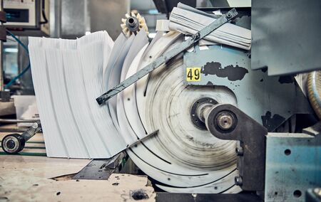 A industrial commercial envelope making machine, making paper envelopes for international...