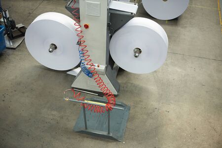 A industrial commercial envelope making machine, making paper envelopes for international...