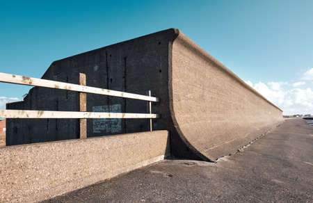 cleveleys lancshire seafront flood defence wall system. Sea defence sea levels rising, climate change. security concrete ramps and curves sea wall. Outdated ocean defences.のeditorial素材