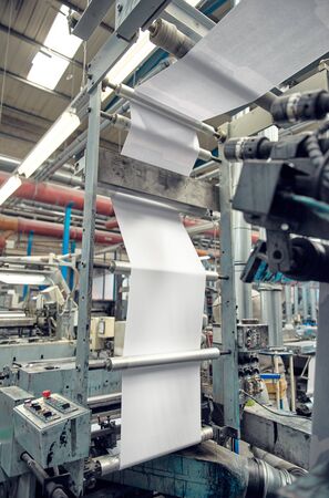 london, uk, 05/05/2019 A industrial commercial envelope making machine, making paper envelopes for...