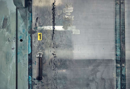 plastic sliding blast shield doors in a manufacturing factory. Plastic doors to contain spray paint and sand blasting industry. Futuristic science fiction style space station protective door hatch.のeditorial素材