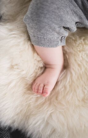 A beautiful soft delicate warm young baby foot photographed with a shallow depth of field. gentle...