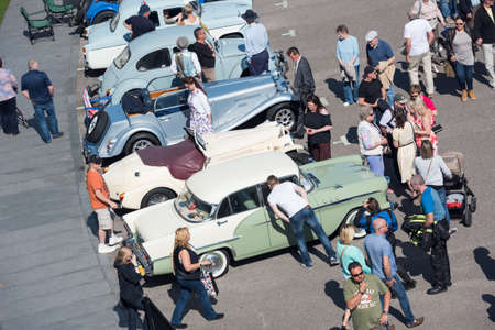london, england, 15/01/2020 Before the coronavirus pandemic, crowds and people socialising at a vintage car show in england. People close to each other in a busy packed car show event spreading the virus.のeditorial素材
