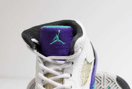 london, england, 05/05/202 White, purple and aqua, nike air baby jordan 4 model retro trainers, for kiddies and toddlers. Air jordan basketball sneakers. Fashionable retro style street fashion.のeditorial素材