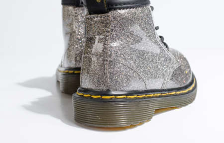 london, england, 05/05/2019 Dr Martens toddler infants silver glitter Leather doc martens baby Boots, 4 Eye lace hole. fashionable punk historic british made leather boots. dr martens air war with bonding soles.のeditorial素材