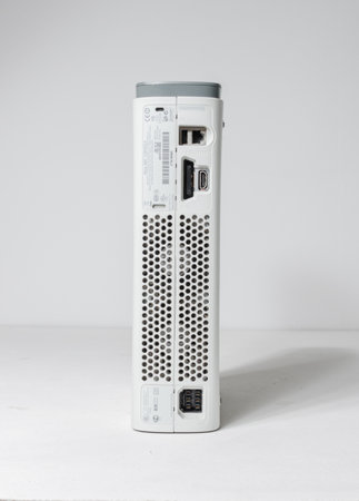 london, england, 05/05/20202 A slim line white Microsoft xbox 360 elite home arcade console isolated...