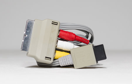 london, england 05/052019 Nintendo wii scart to tv audio video convertor unit power adaptor unit on a white isolated background. iconic retro vintage video gaming machine.のeditorial素材