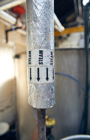 steel old vintage relic Industrial Pipe Valve steam pipe, a wheel to turn and release pressure for...