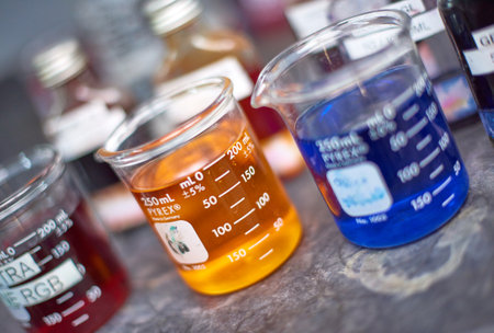 Kent, uk, 01.01.2023 Pyrex Chemical dye equipment and beakers in a fabric and industrial colouring cotton laboratory factory. Dying fabrics for the fashion industry. Glass industrial bottles.のeditorial素材